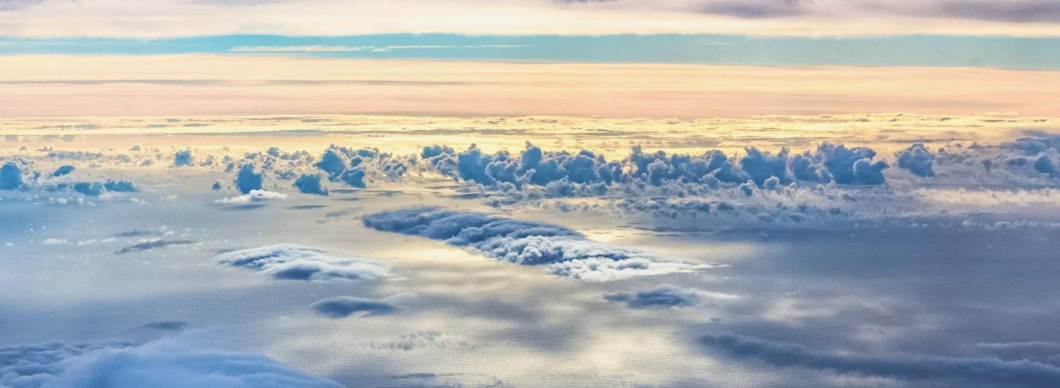 View of clouds capturing the morning light taken from the NASA DC-8 shortly after it took off from the Azores en route to Bangor, Maine on October 23, 2017. 