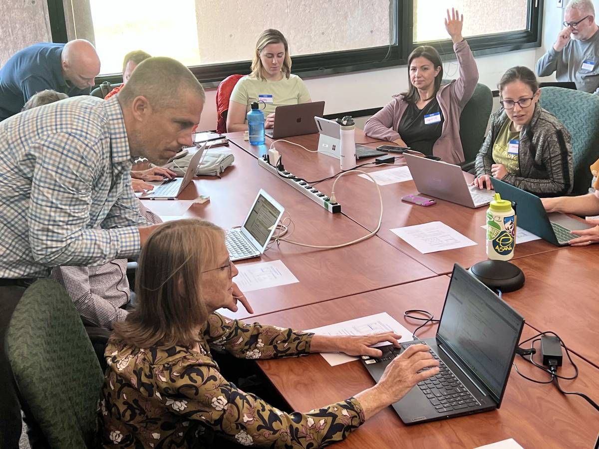 Image of people sitting around a table