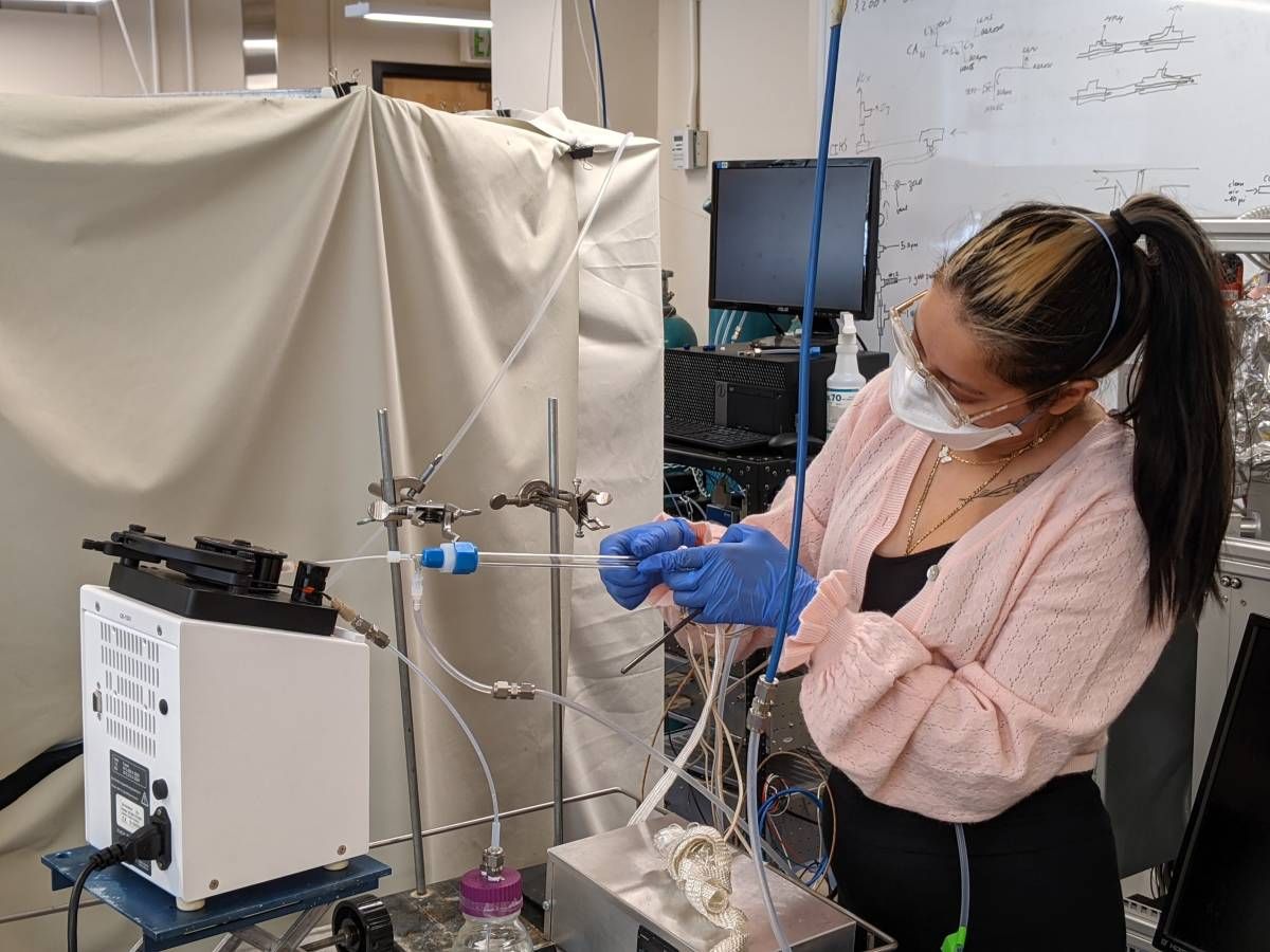 Karla Lemus setting up a peristaltic pump