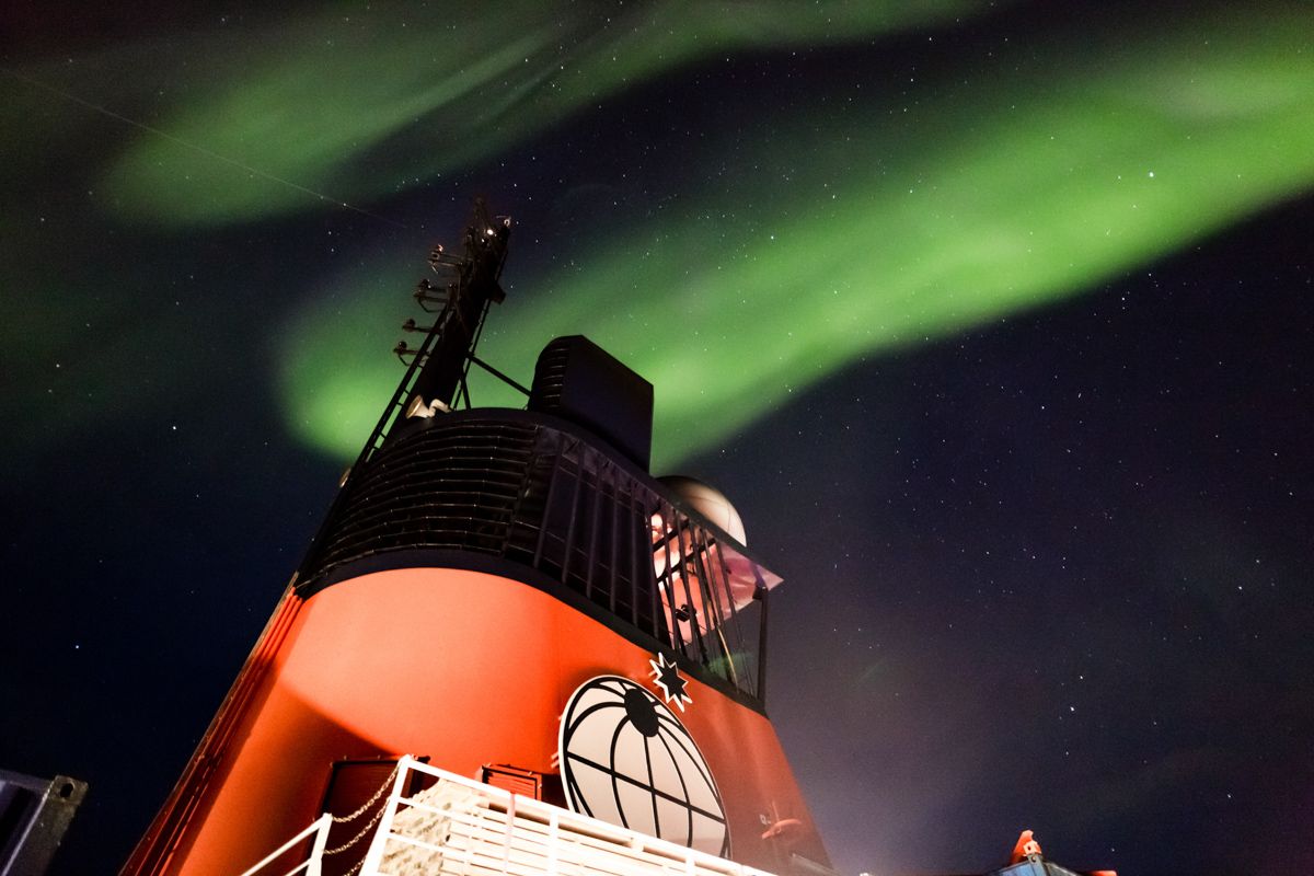 The RV Polarstern, with the Northern Lights in the background.