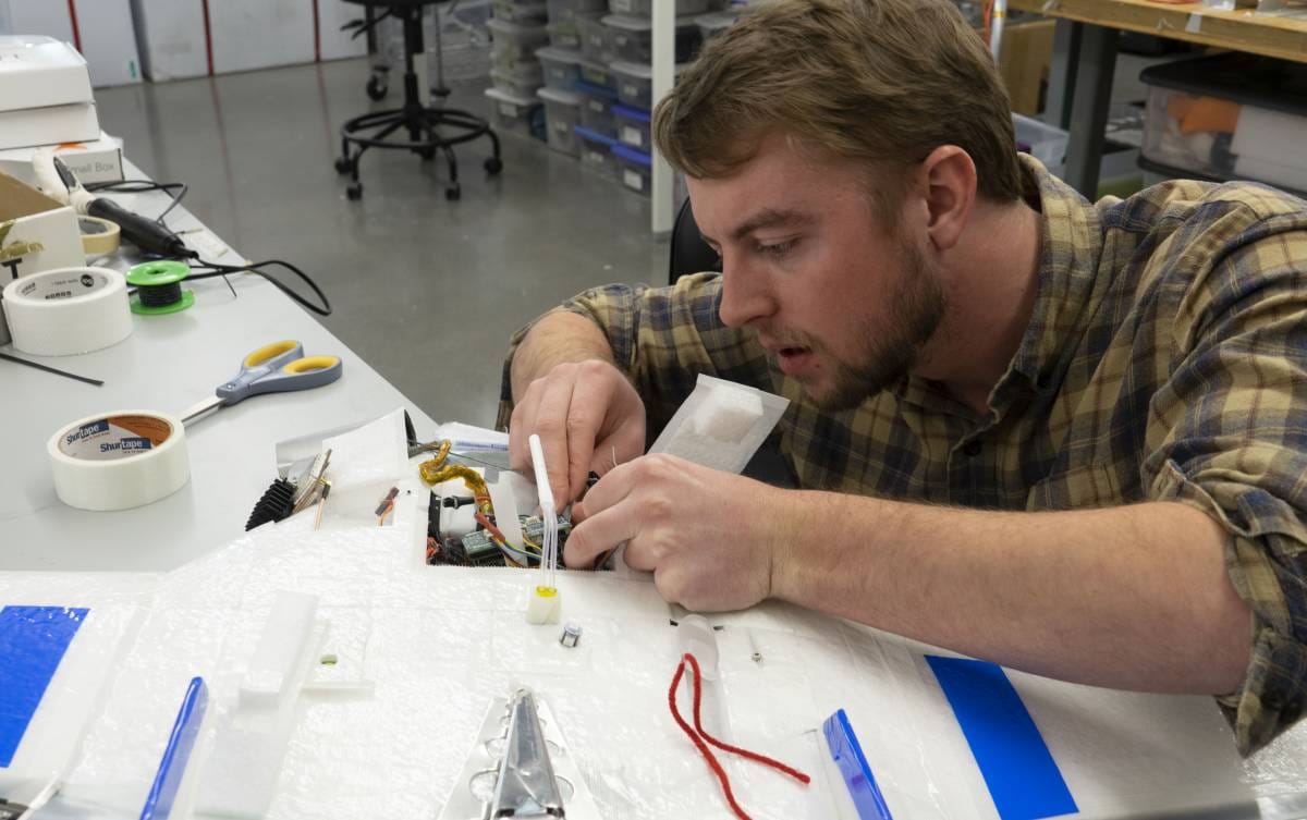 Jonathan Hamilton prepares a Datahawk drone. 