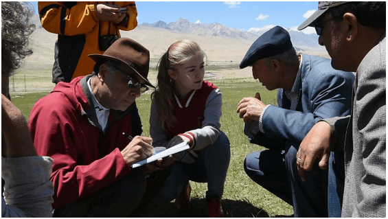 Kassam working in China.