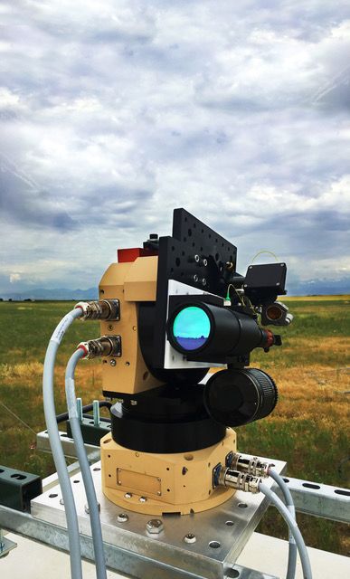 Dual frequency comb spectrometer observing system set up in the field.