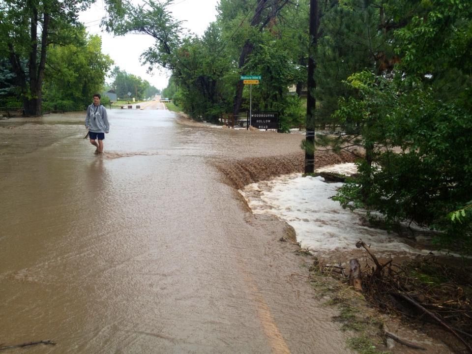 FLOOD WATERS FILL A ROAD DURING THE 2013 BOULDER FLOOD