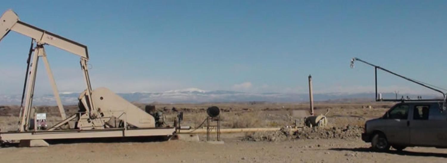Oil well pad and atmospheric sampling van in Uintah County, Utah.