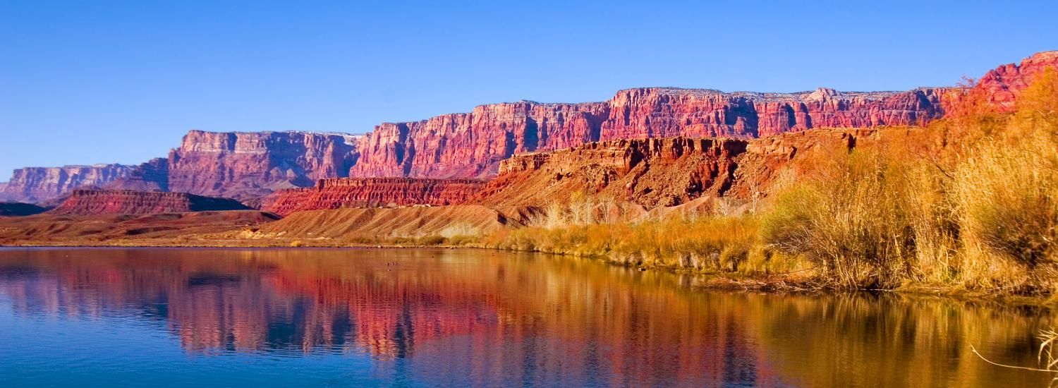 Canyon reflects in water along the Colorado River