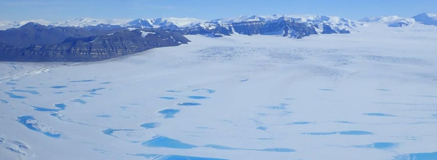 Photo of meltwater lakes on Antarctica's George VI Ice Shelf. 