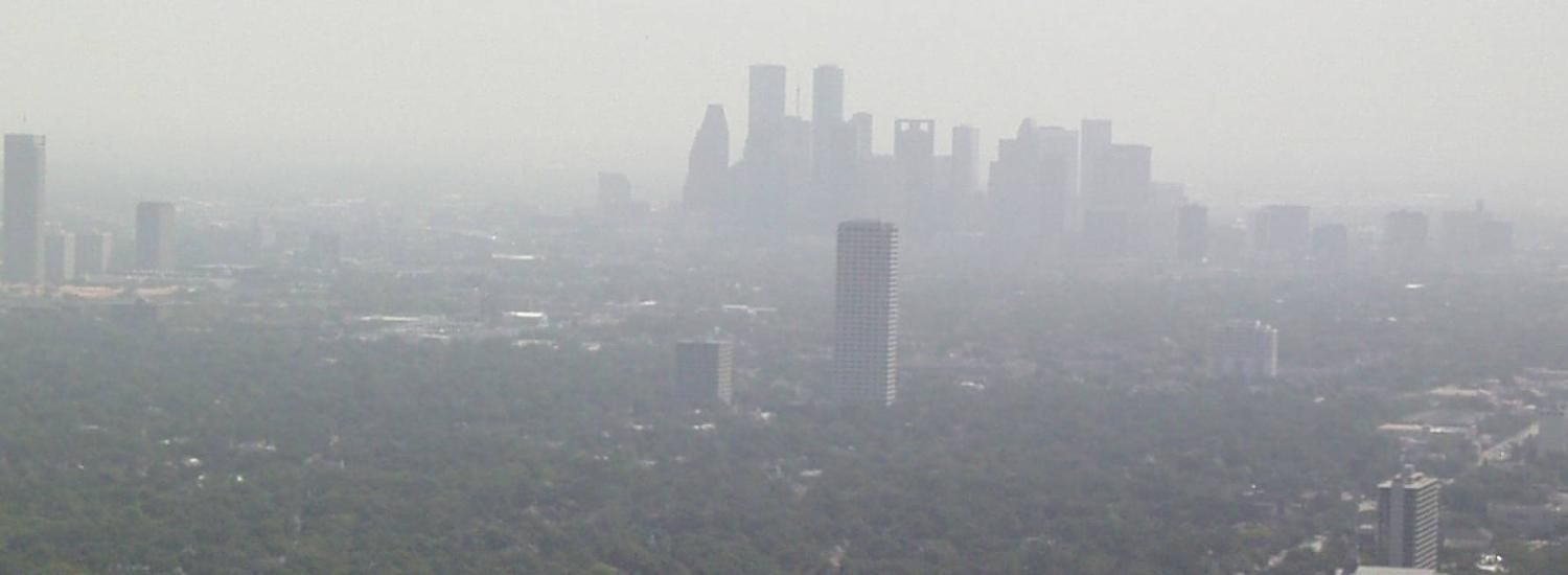 Photo of polluted downtown Houston skyline.