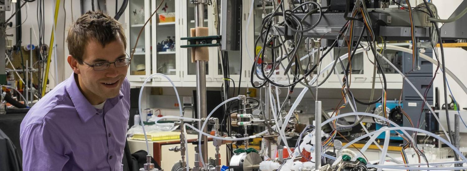 Scientists at work in laser lab at NOAA ESRL