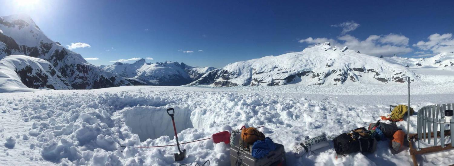 instruments in snow at base of alaskan mountain and glacier