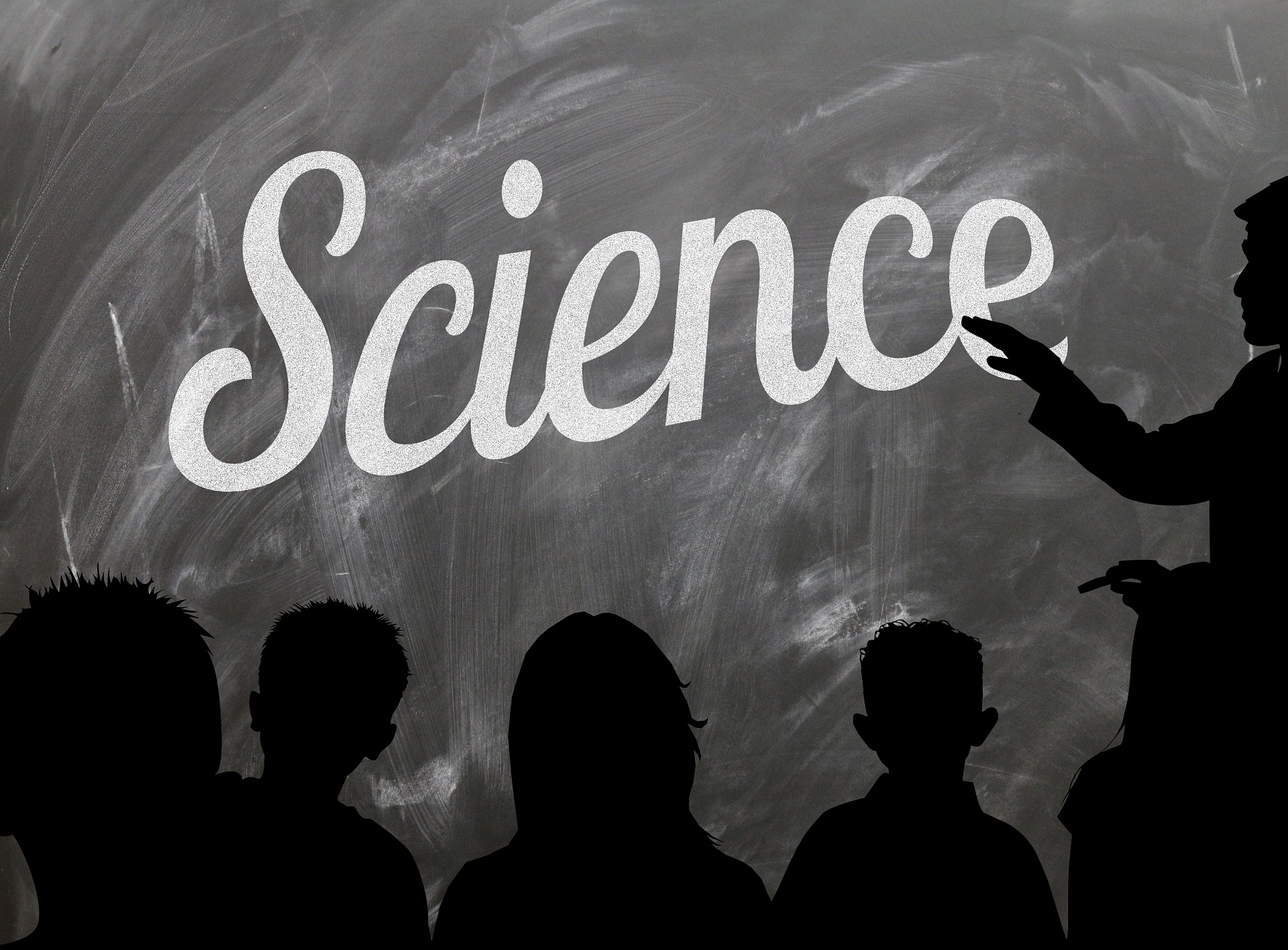 Silhouettes in front of chalkboard that says science