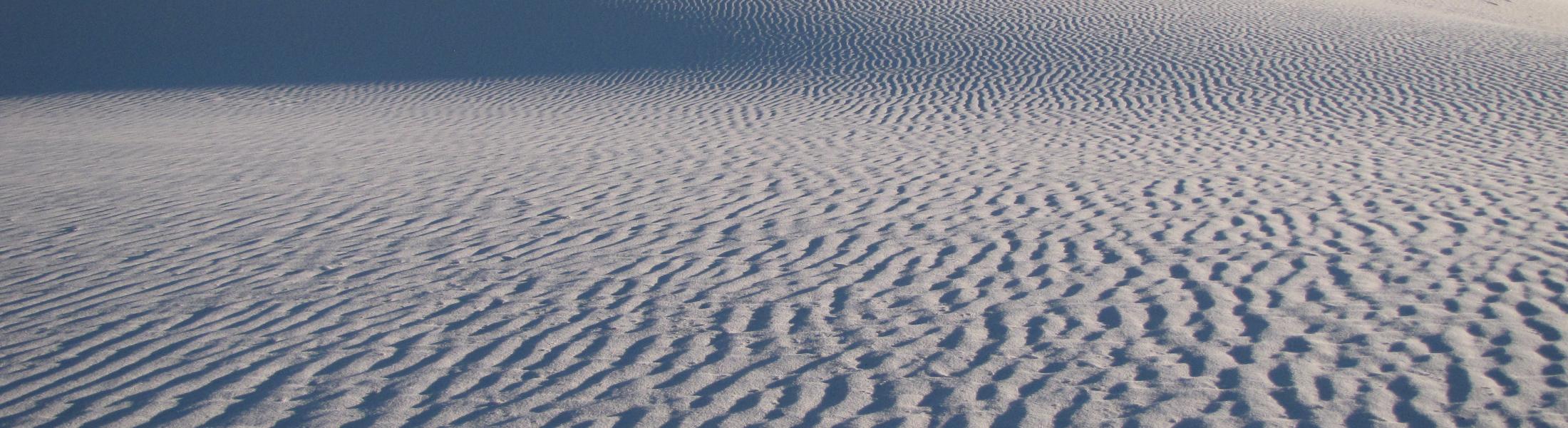 Wind ripples on enormous dunes.