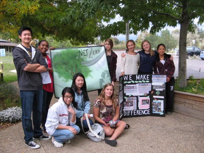This is an image of 9 students who are sharing their environmental projects. 