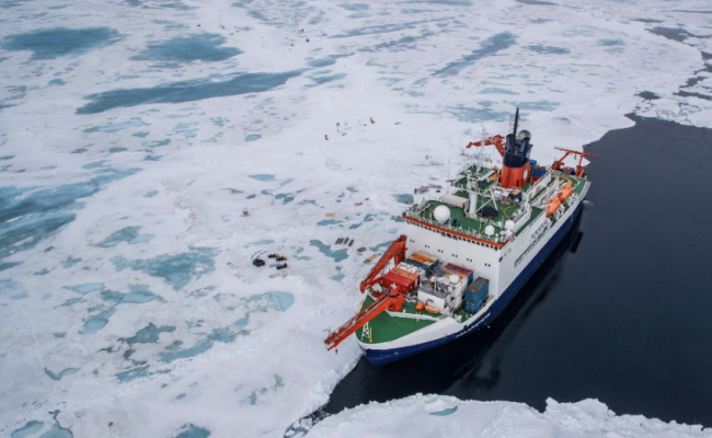 Seen from the air the Polarstern floats alongside the MOSAiC ice floe