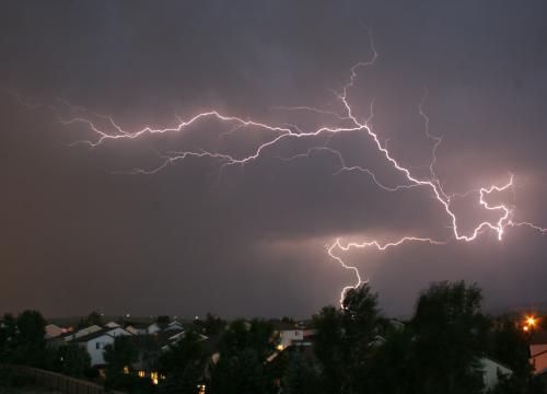 large bolt of lightning across night sky