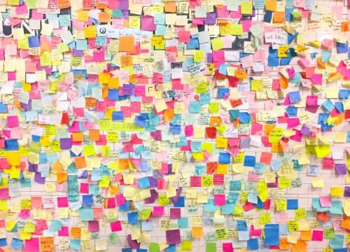 A wall full of colorful post-it notes.