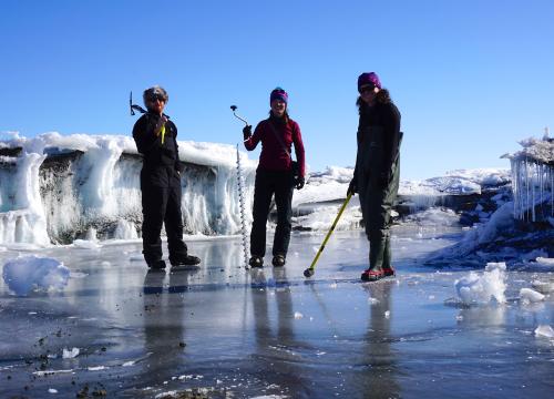 3 scientists on a frozen lake