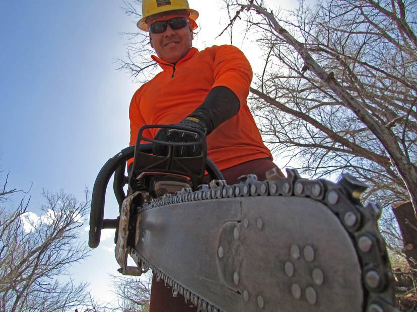 Man holding chainsaw