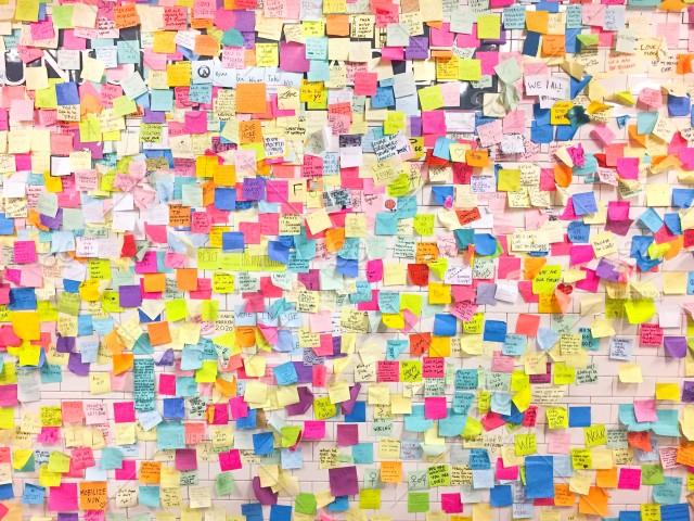 A wall full of colorful post-it notes.